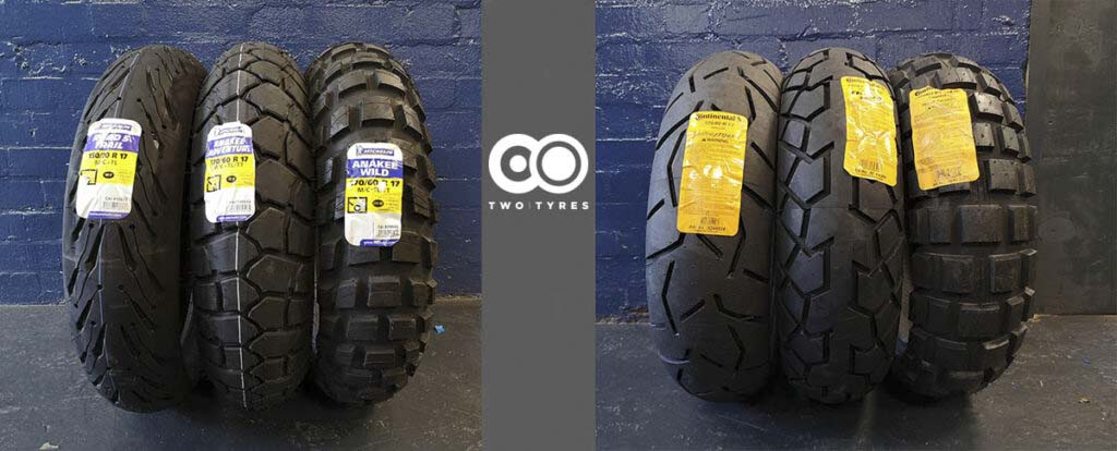 Flat lay or garage shot comparing multiple ADV tires side by side