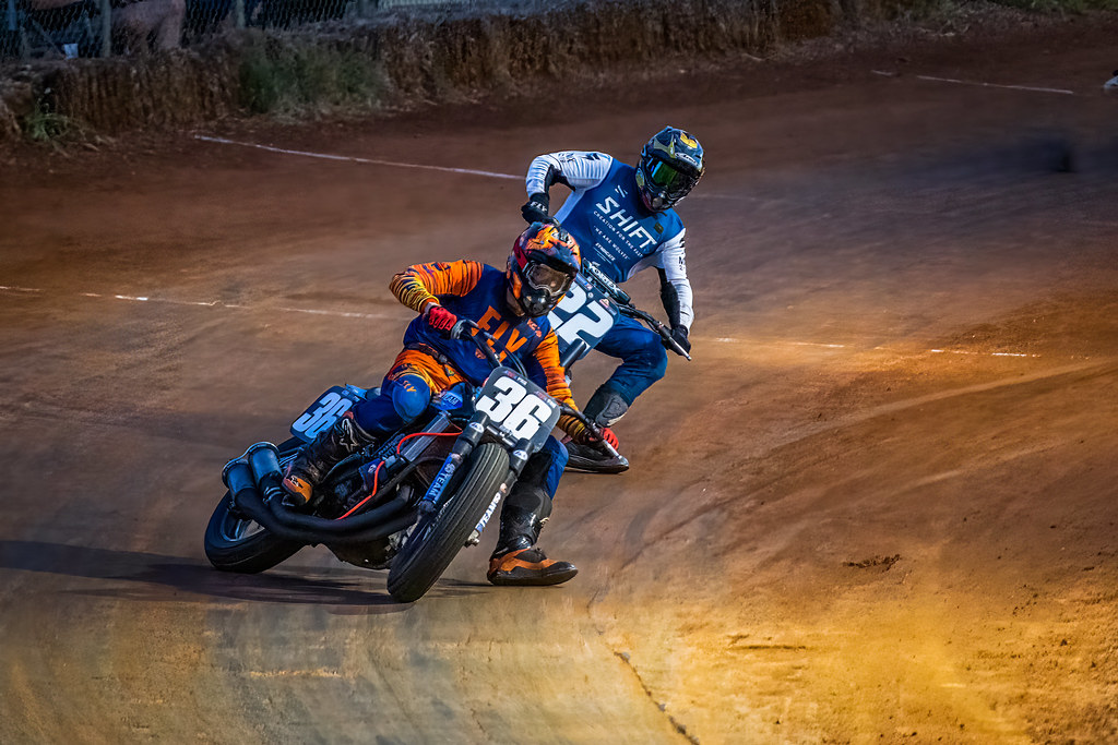 Dynamic action shot of a rider sliding through a corner