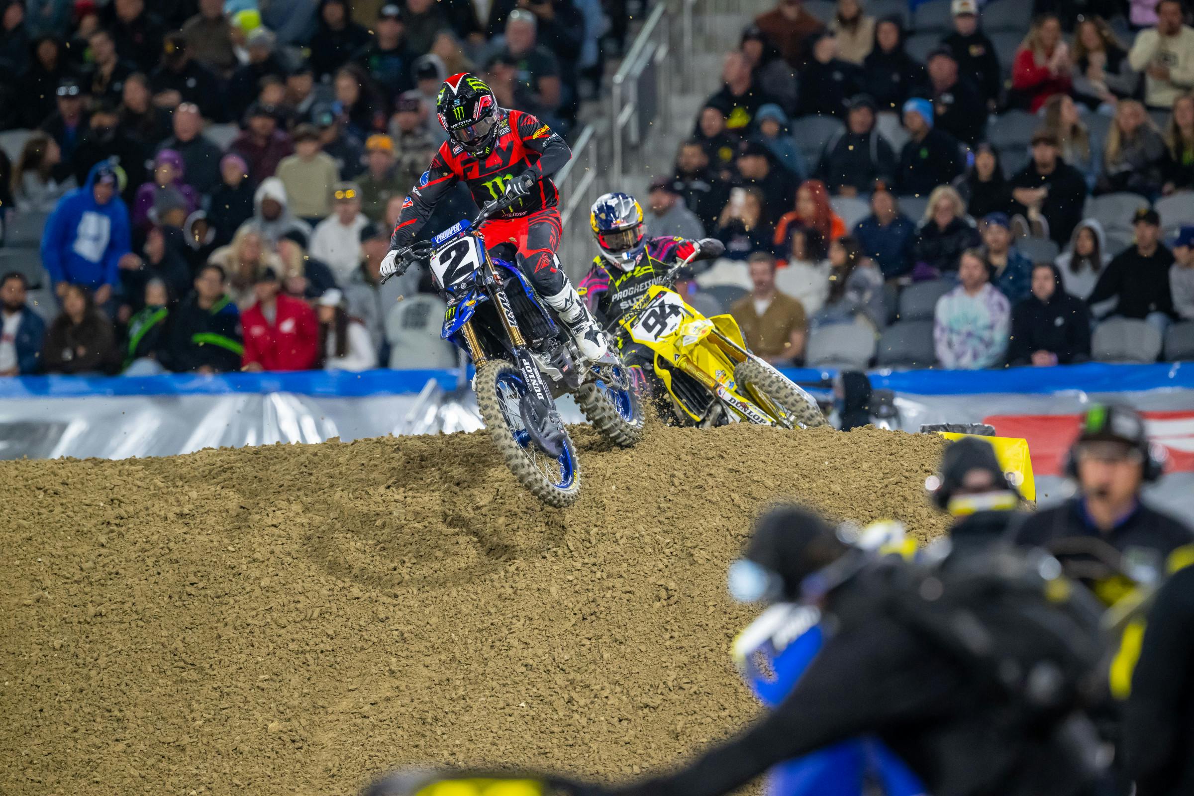 450SX class racing action with multiple riders