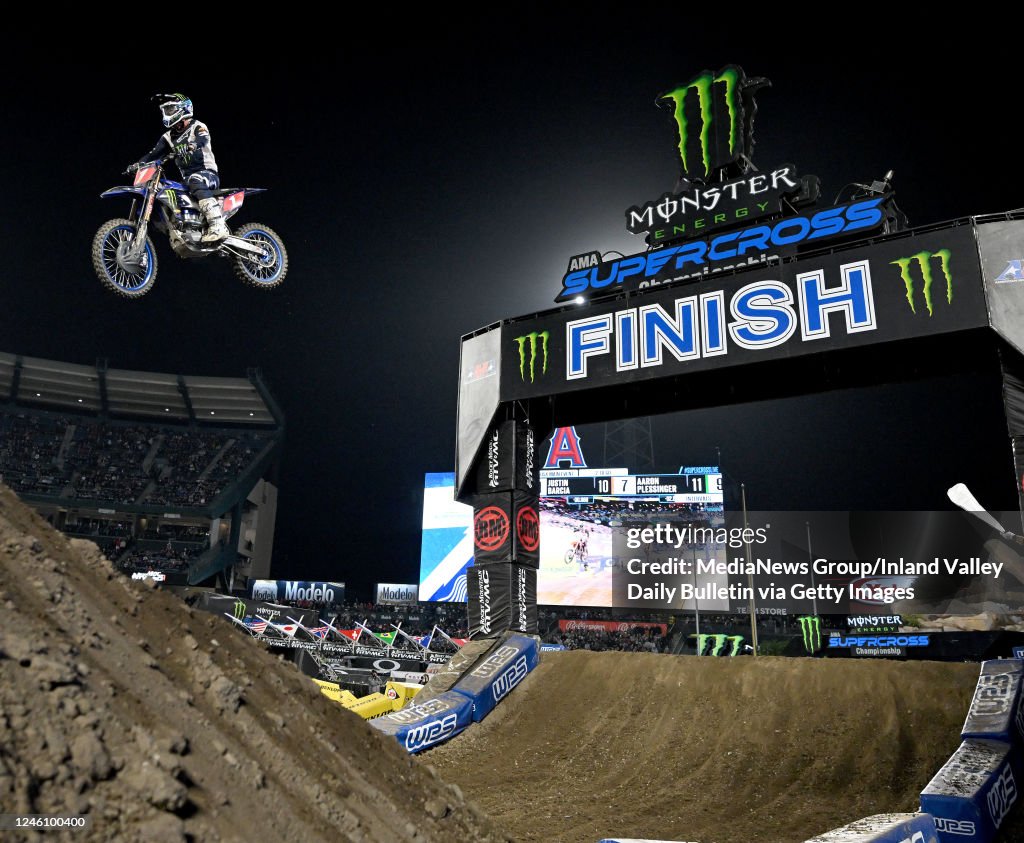 Hero image — packed stadium supercross main event at night