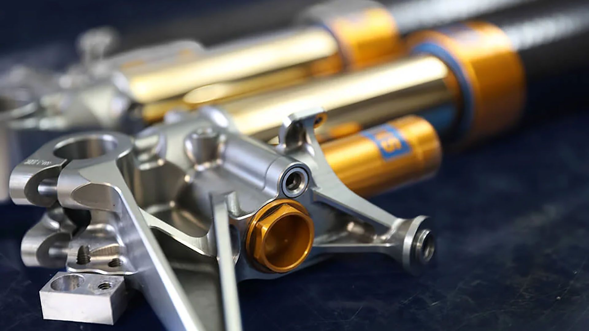 Close-up of premium Öhlins suspension components referenced in article