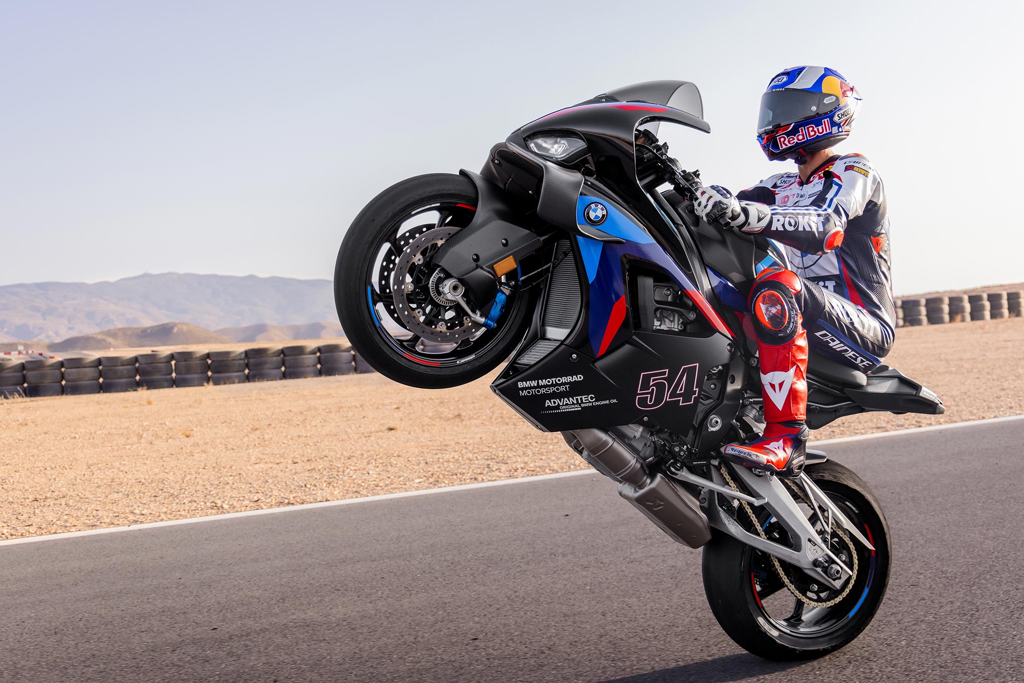 BMW M 1000 RR at speed on a closed circuit