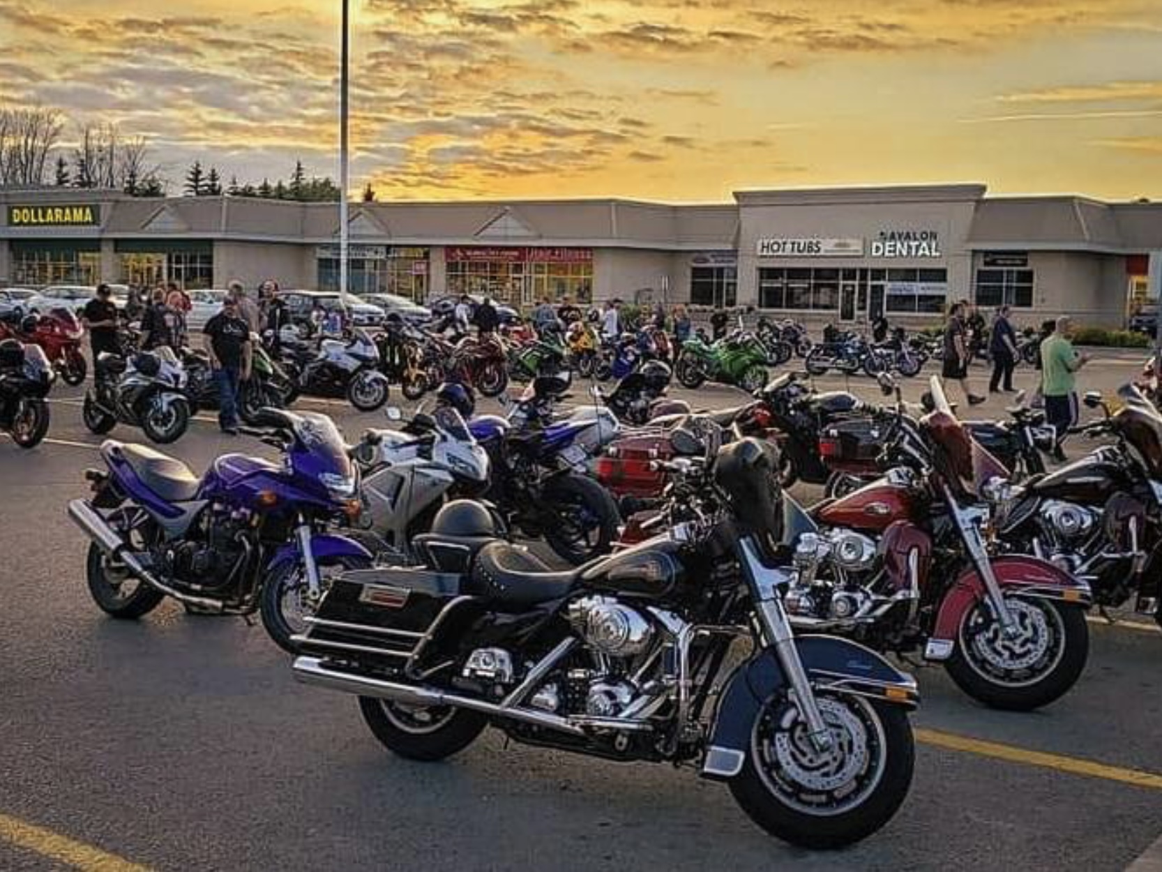 Riders gathered at a club meet-up or moto social event