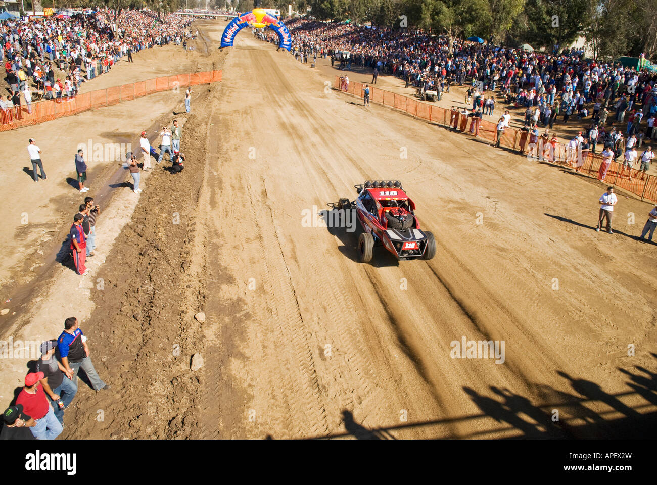 Pro moto class riders launching at the Ensenada start line