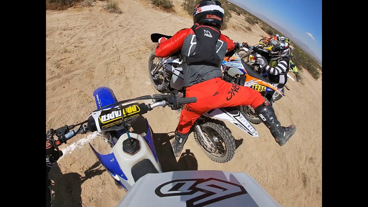 Pit crew executing a fast fuel and tire stop during desert race