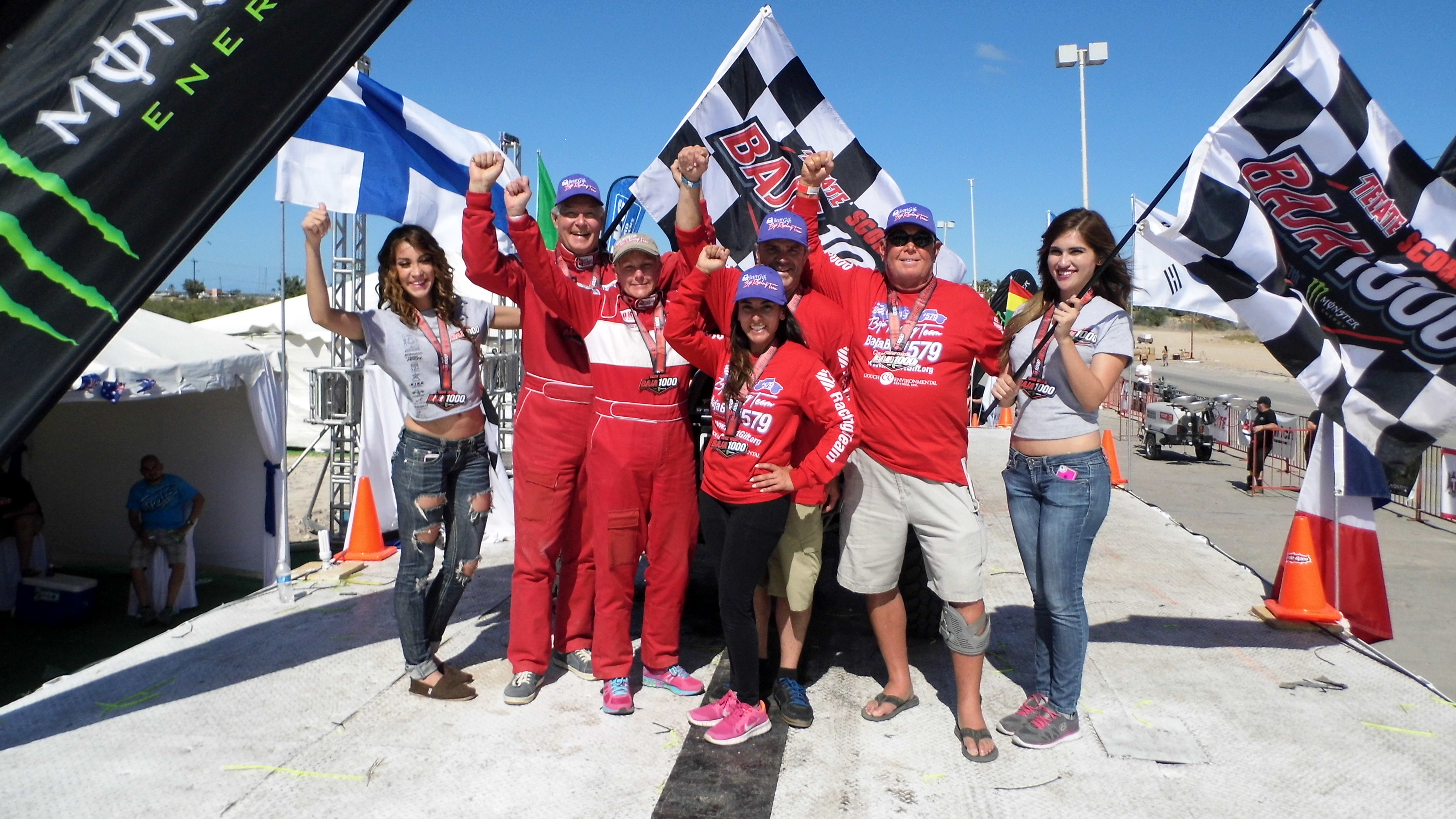 Riders and crowd celebrating at the La Paz finish line