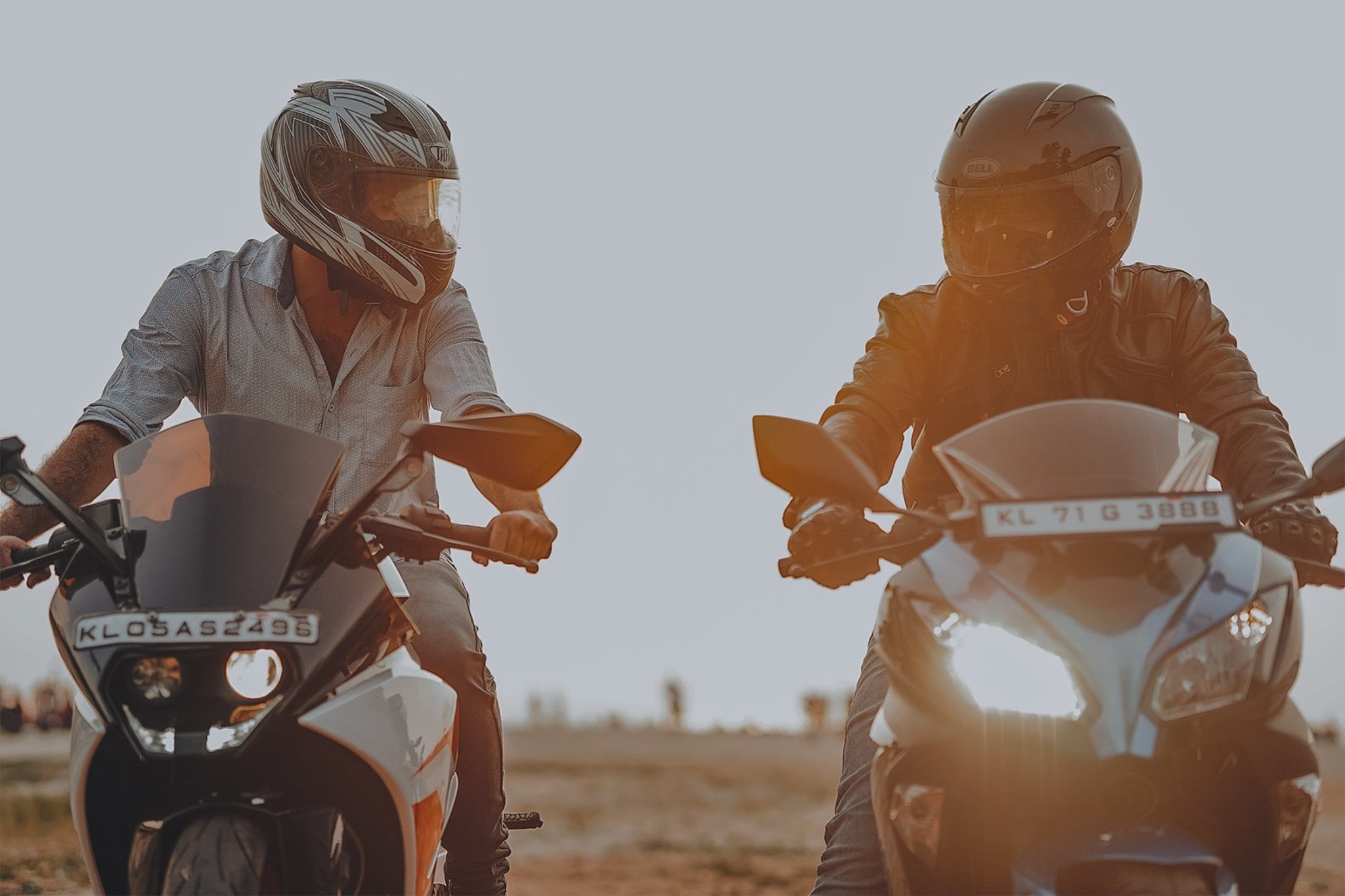 Close-up of intercom speakers being installed inside a full-face motorcycle helmet