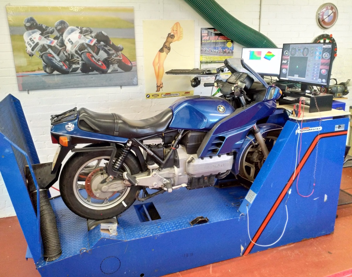 Close-up of Akrapovic Evolution Line titanium exhaust on a naked bike