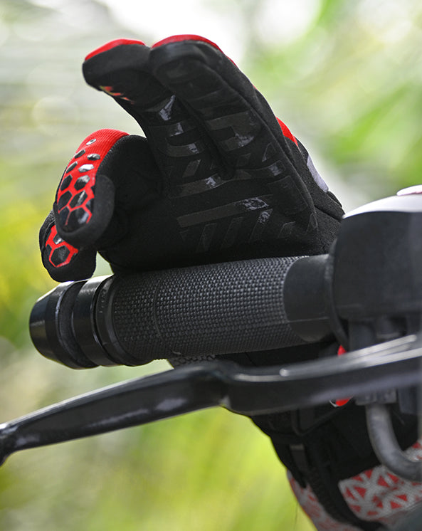 Rider wearing insulated waterproof gloves in cold or rainy conditions