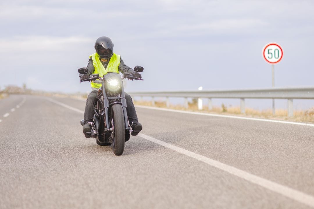 Hero image showing a rider clearly wearing a high-visibility vest while riding