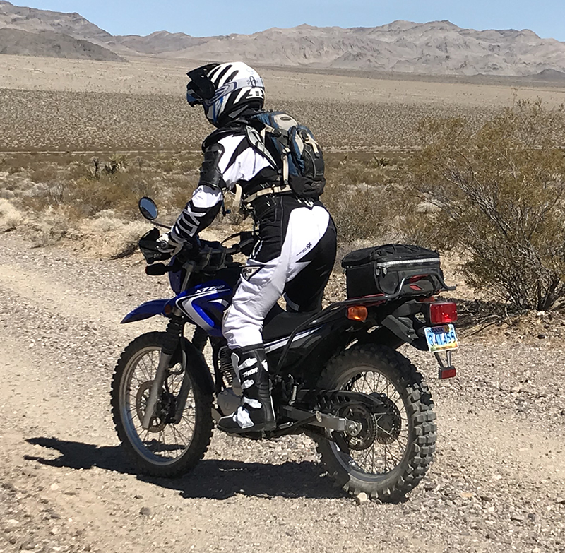 Image of an off-road rider using a hydration pack
