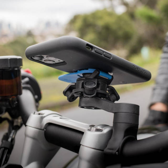 Quad Lock Pro mount installed on motorcycle handlebar