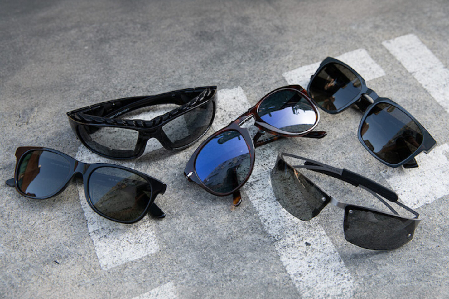 Product comparison flat lay of multiple riding eyewear options