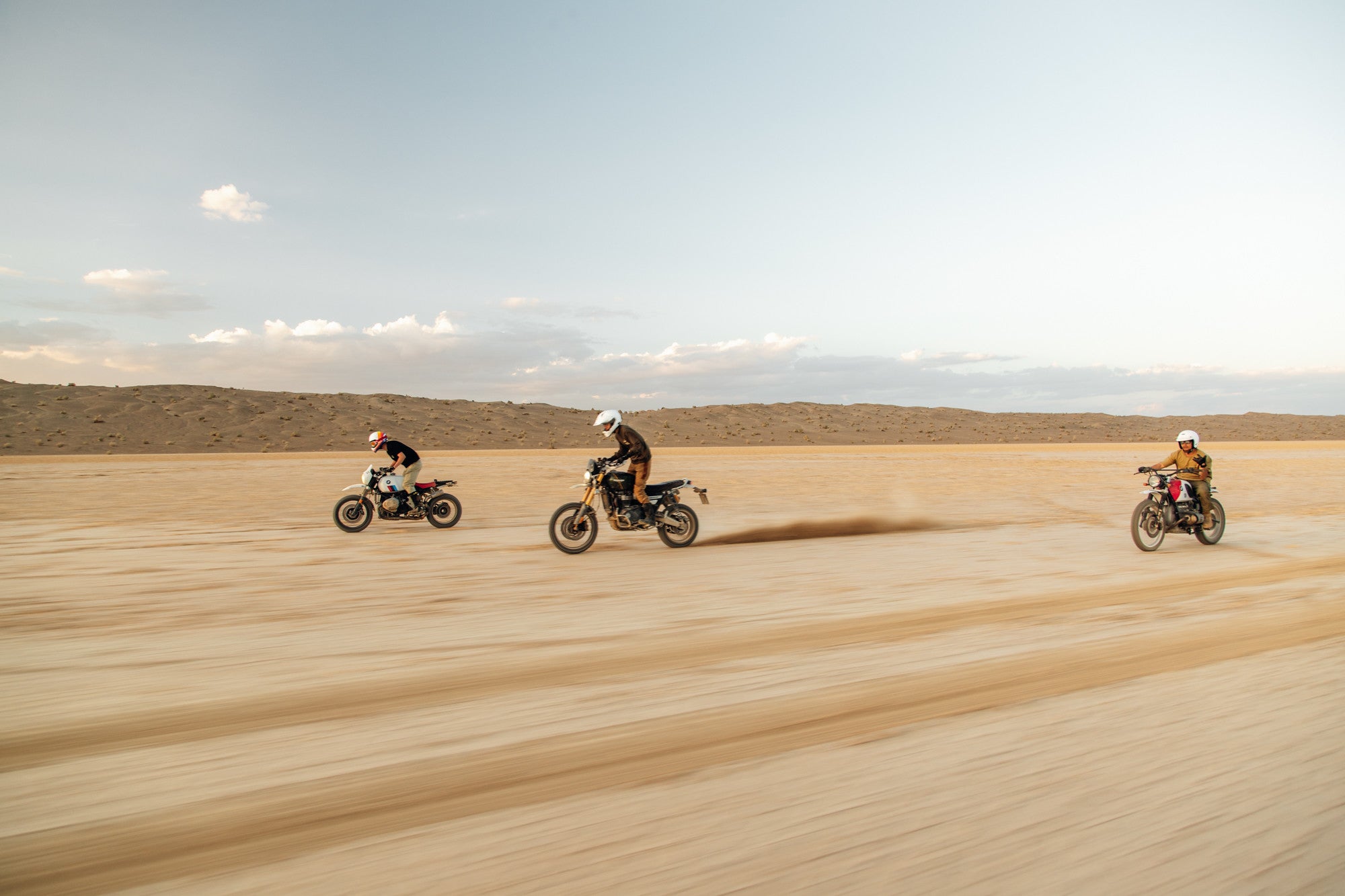 Detail shot showing adventure bike suspension on rough terrain