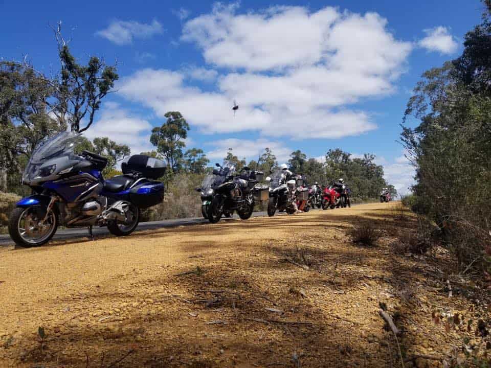 Hero image showing a touring motorcycle on a sweeping open highway