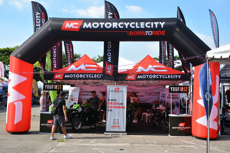 Riders checking in at a charity motorcycle ride registration table