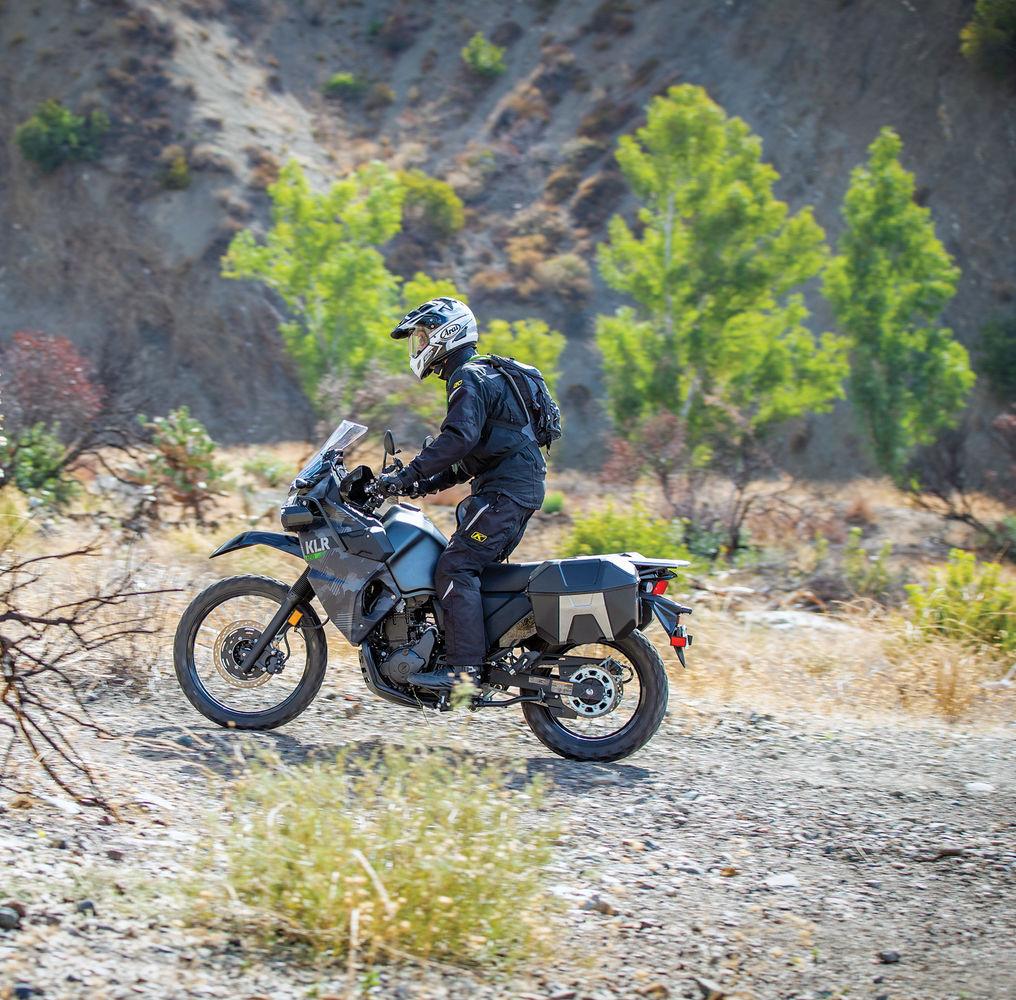 KLR650 on dirt or gravel trail for adventure section