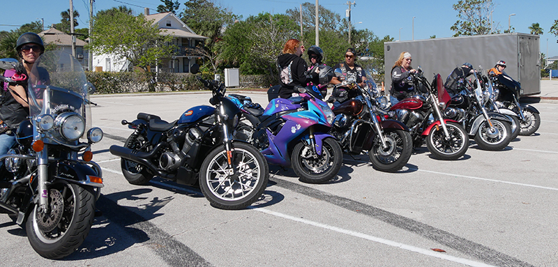 Riders gathering at a staging area before a group ride