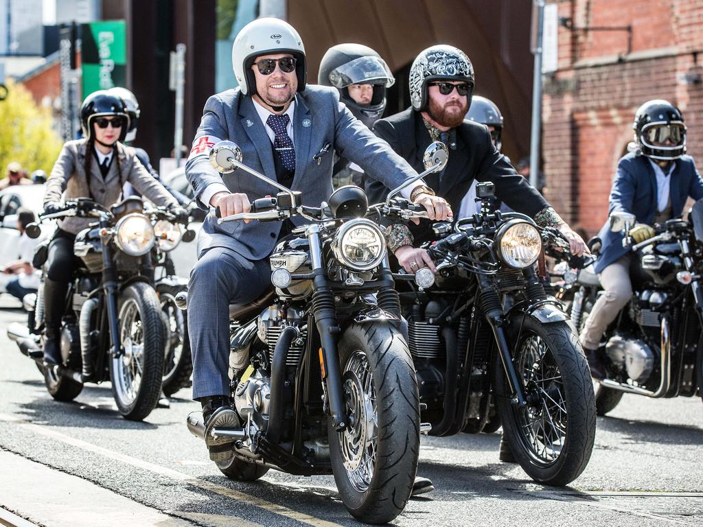 Group of DGR participants gathered at a staging area before the ride