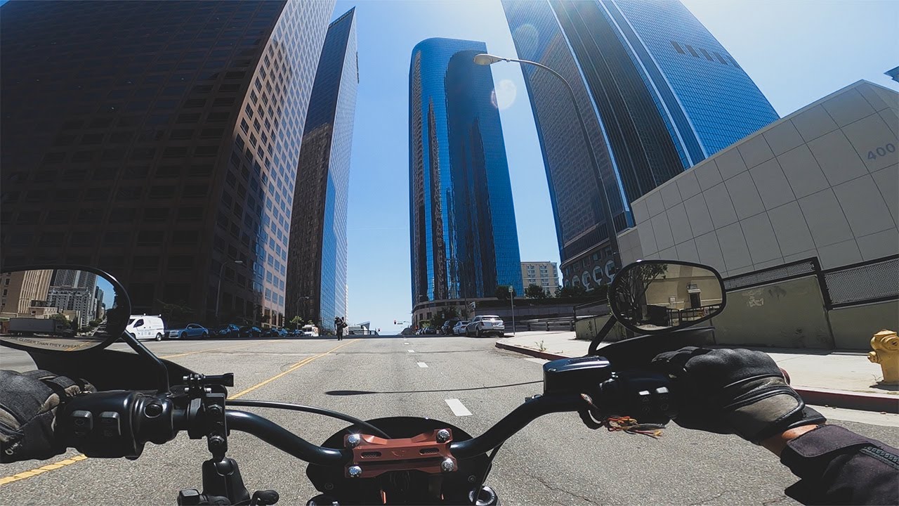 Motorcycles riding through or near downtown Los Angeles