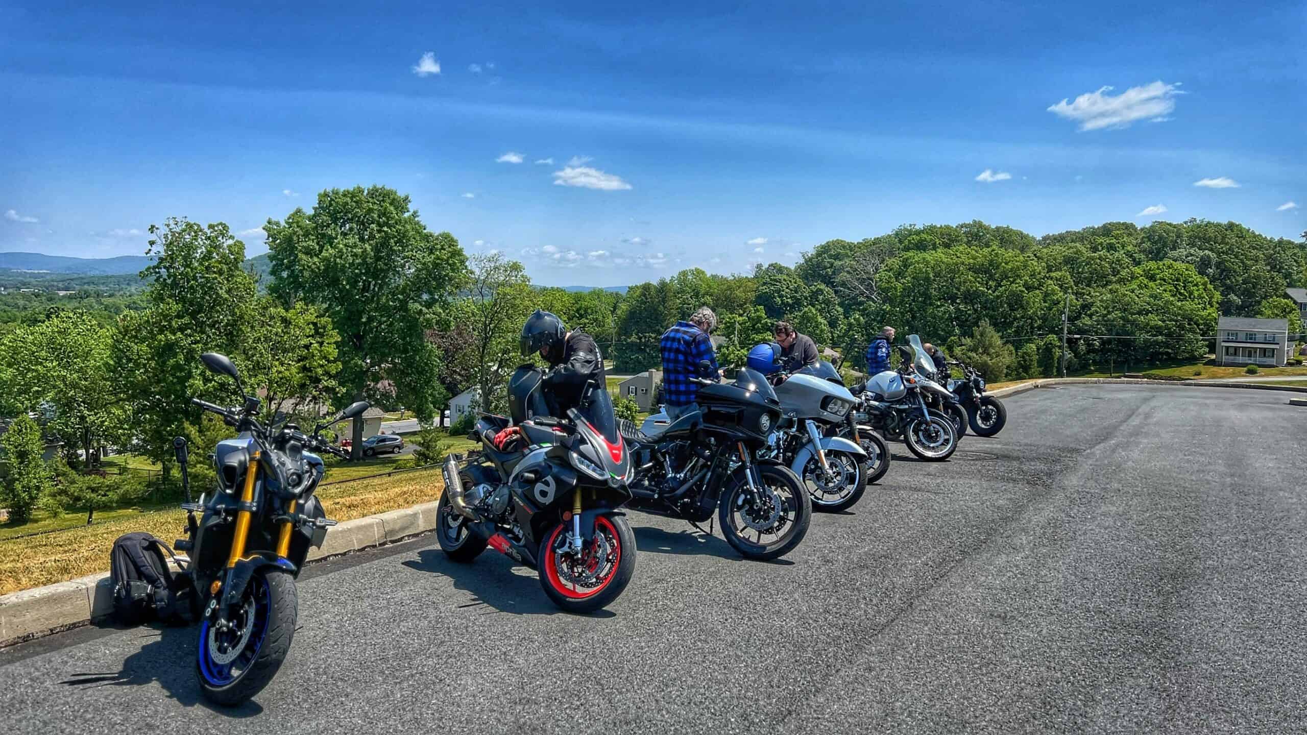 Riders gathering at a staging area before a group ride, capturing pre-ride atmosphere