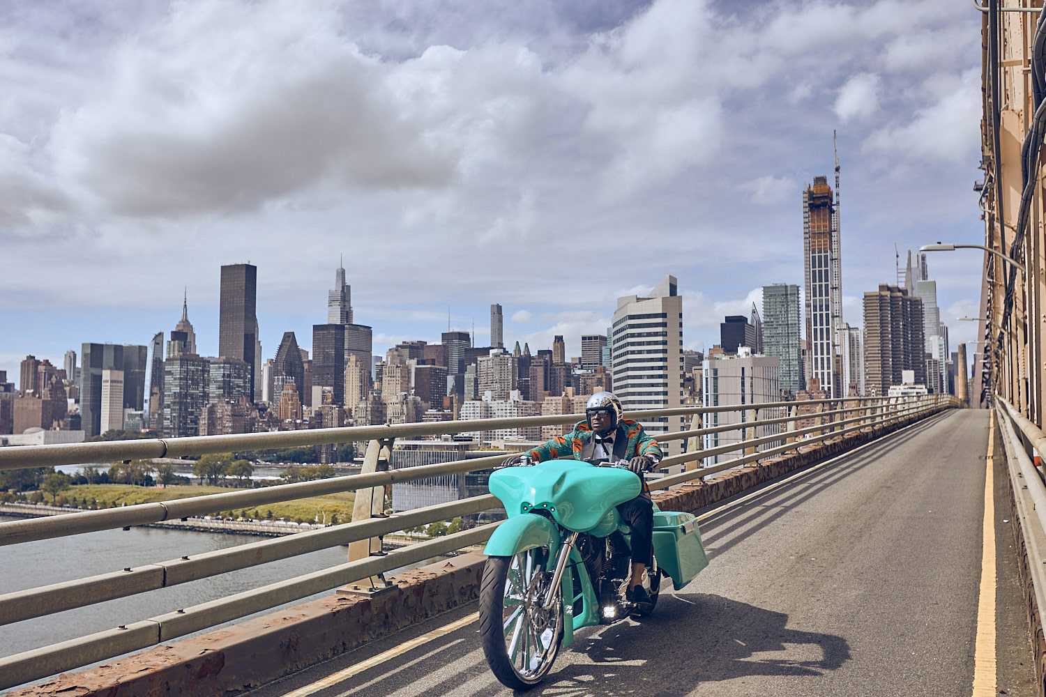 Motorcyclists in New York City with urban backdrop
