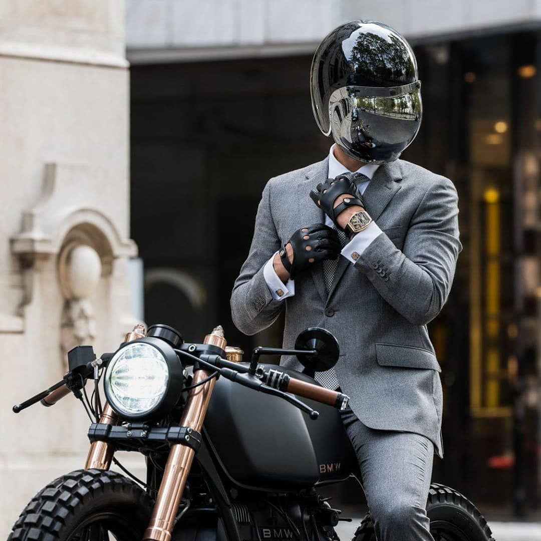 Example of DGR dress code — dapper attire on a classic motorcycle