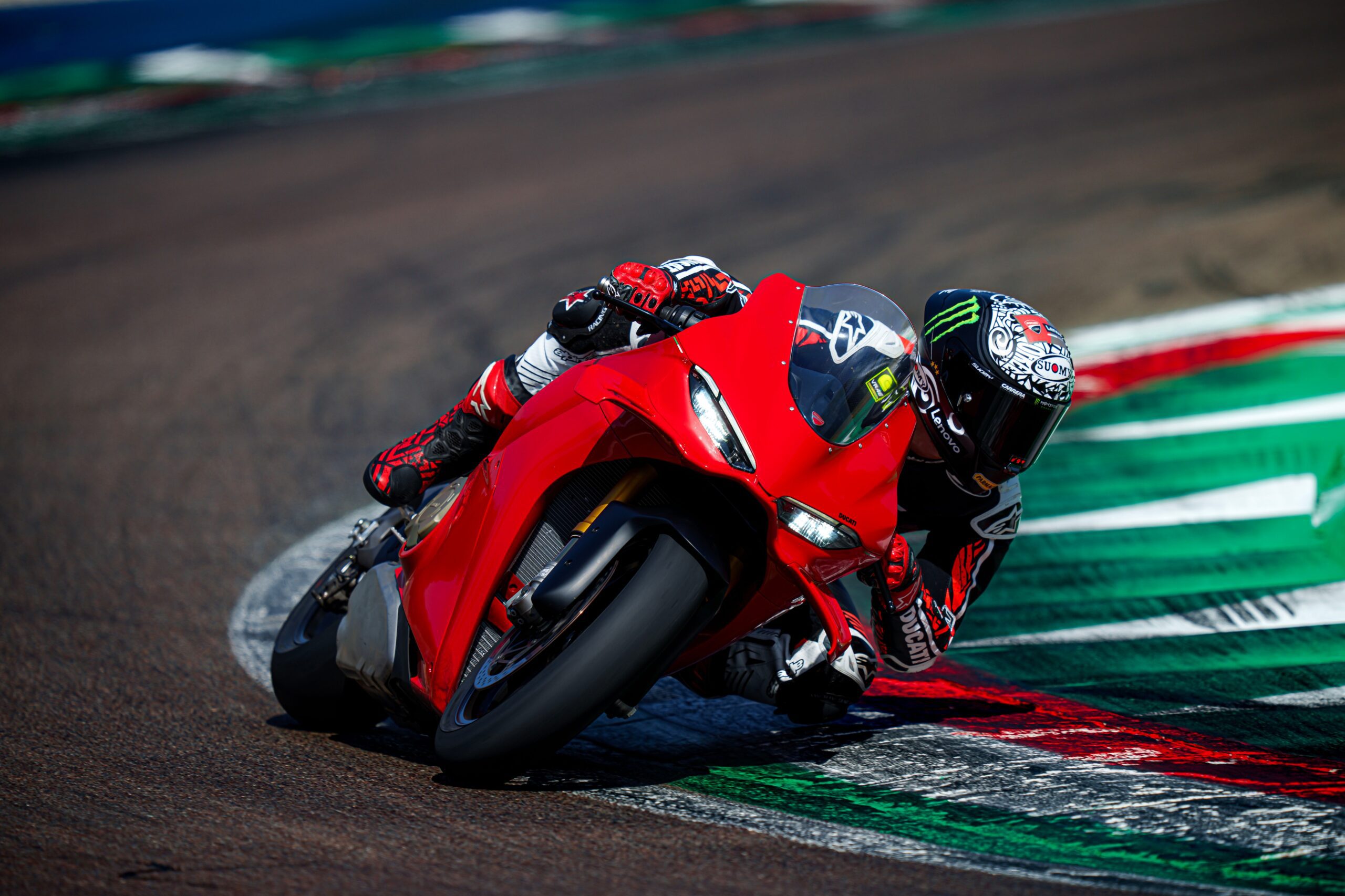 Action shot of Panigale leaning aggressively on track to illustrate performance expectations