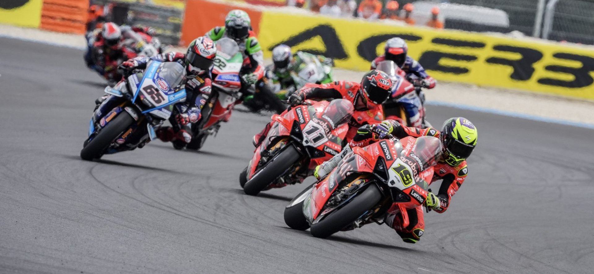 Close wheel-to-wheel superbike racing action for Race 1 section