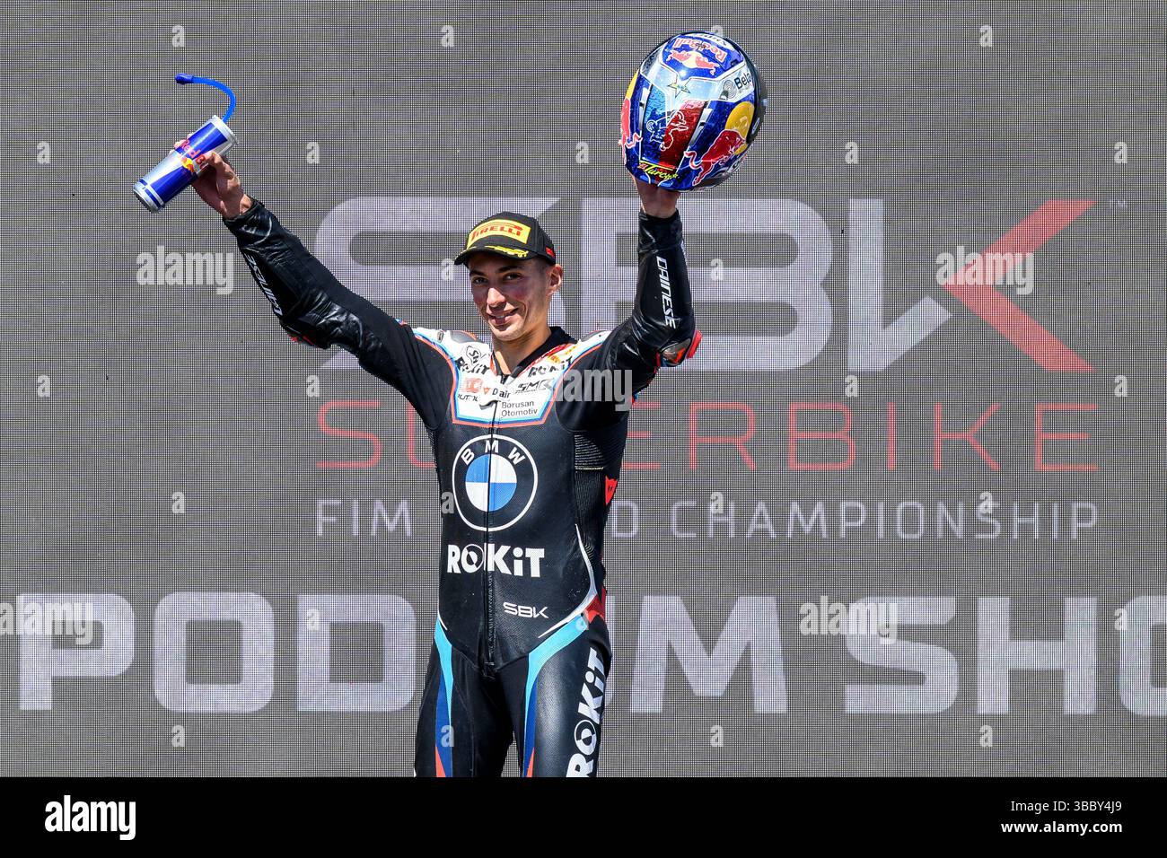 WorldSBK podium celebration scene showing riders and trophies
