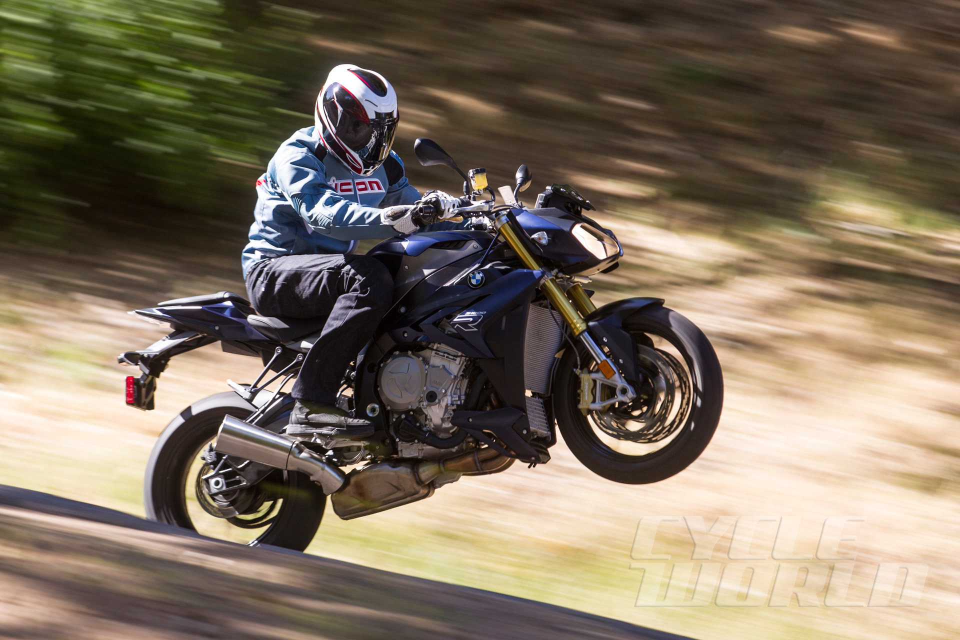 Action shot of rider on S 1000 R through mountain hairpins