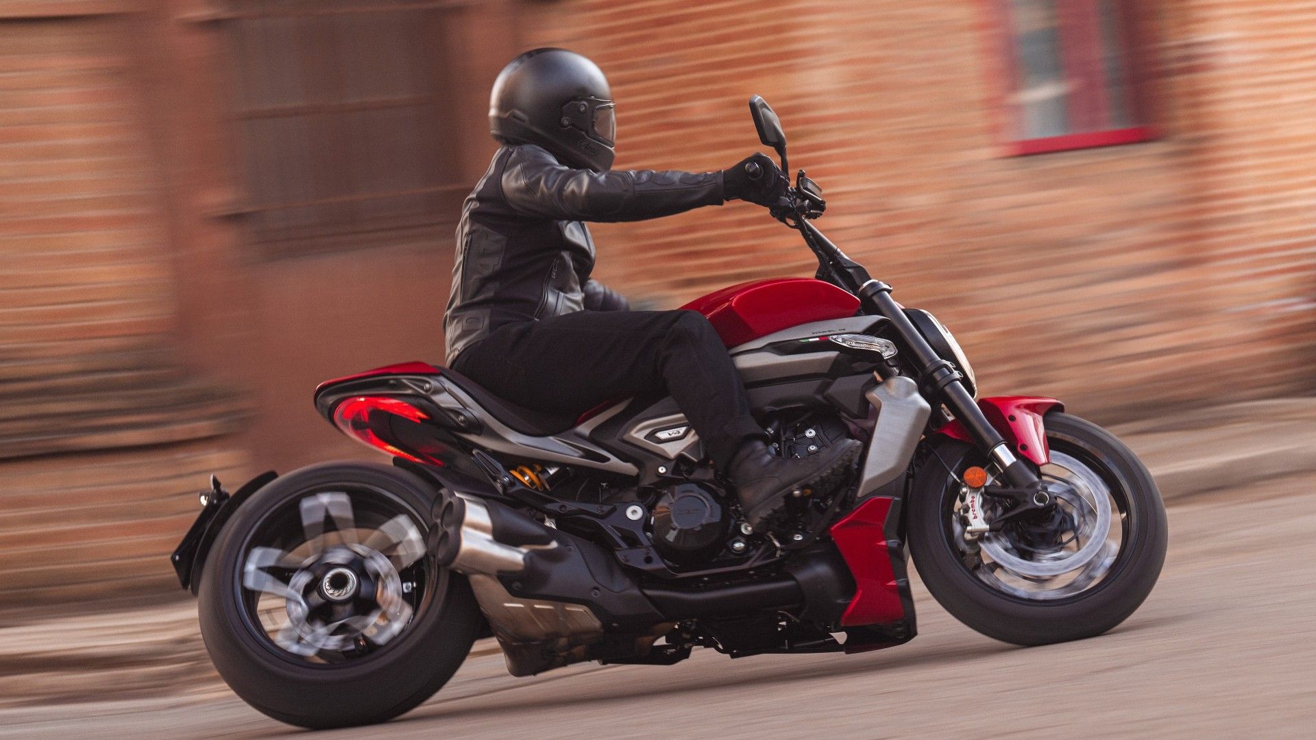 Action shot of rider leaning through a canyon curve