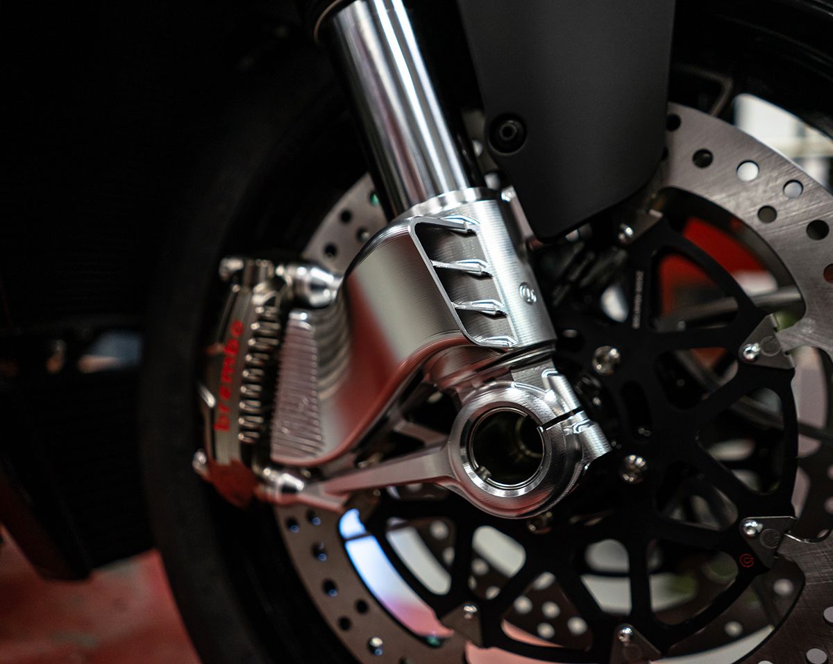 Detail shot of front Showa Big Piston fork and braking system