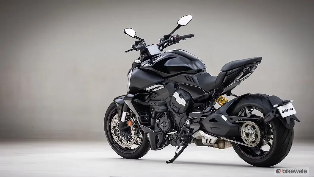 Rear three-quarter beauty shot showing tail and exhaust