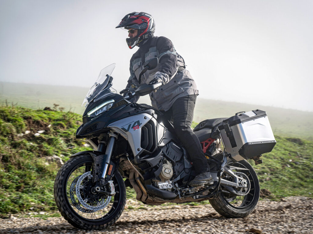 Rider on Multistrada tackling a gravel or unpaved road section