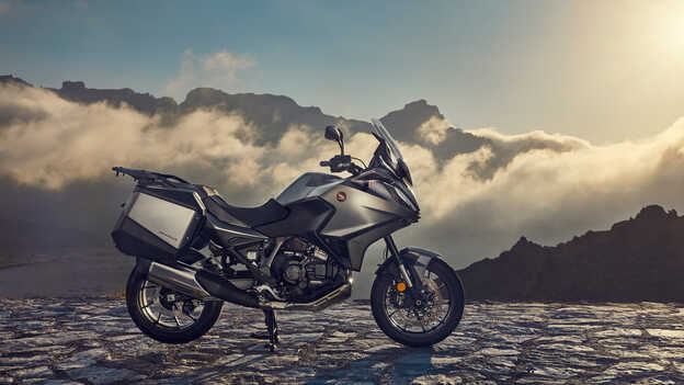 Rider on NT1100 on a sweeping mountain road