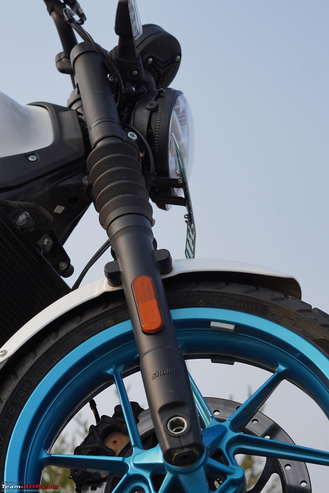 Front end detail showing the USD forks and 21-inch front wheel