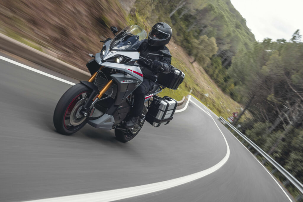 Action shot of rider on sport tourer through mountain canyon curves