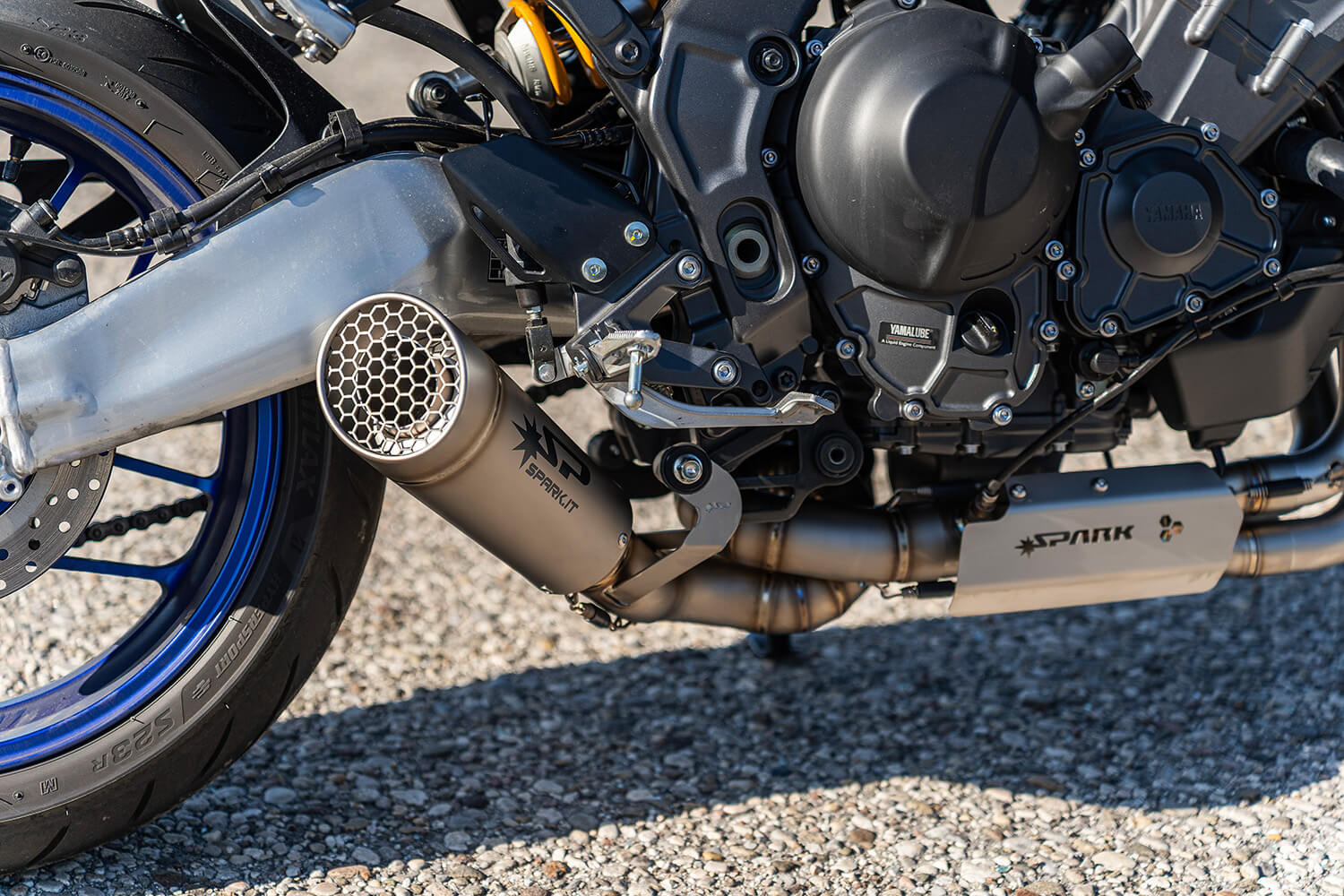 Close-up of the 890cc crossplane triple engine and exhaust header