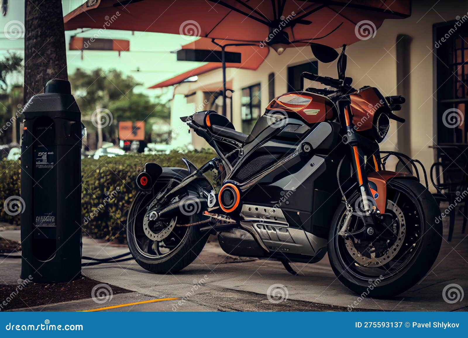 Motorcycle plugged into Level 2 charging station