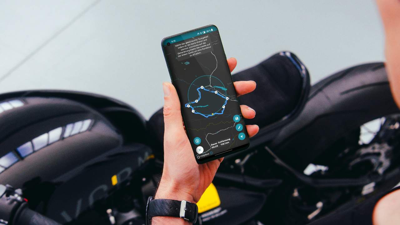 Conceptual image of OTA update or rider using phone app with motorcycle