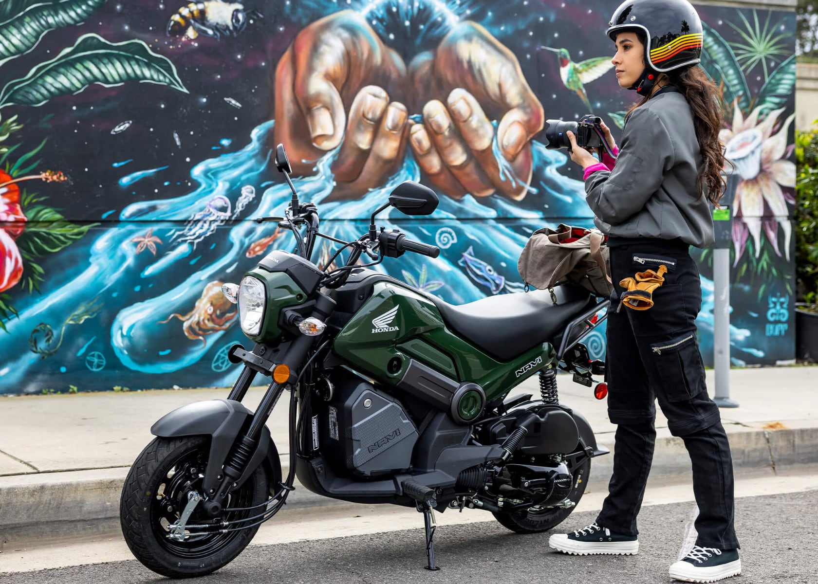 New rider on a small Honda motorcycle in a city environment for the final thoughts section