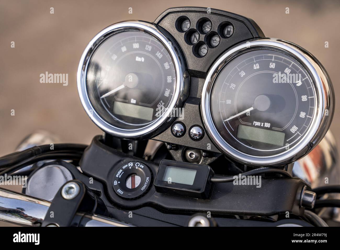 Close-up comparison of the dashboard or instrument clusters on the three bikes
