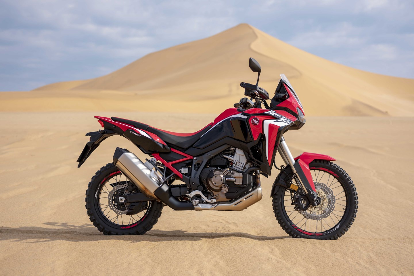 Africa Twin being ridden on gravel or dirt to illustrate off-road section