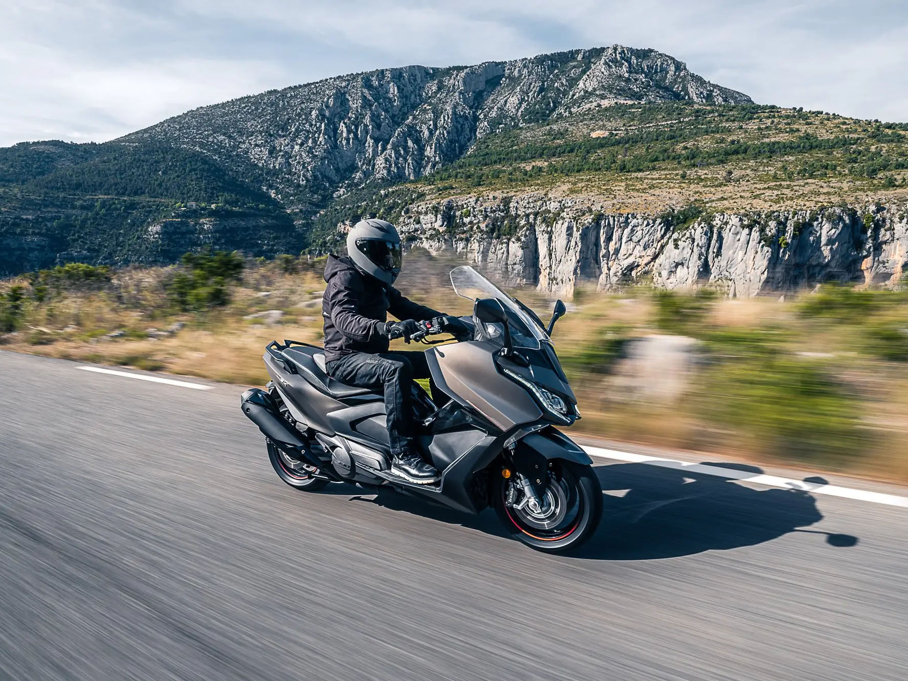 Kymco AK 550 cornering or dynamic riding shot