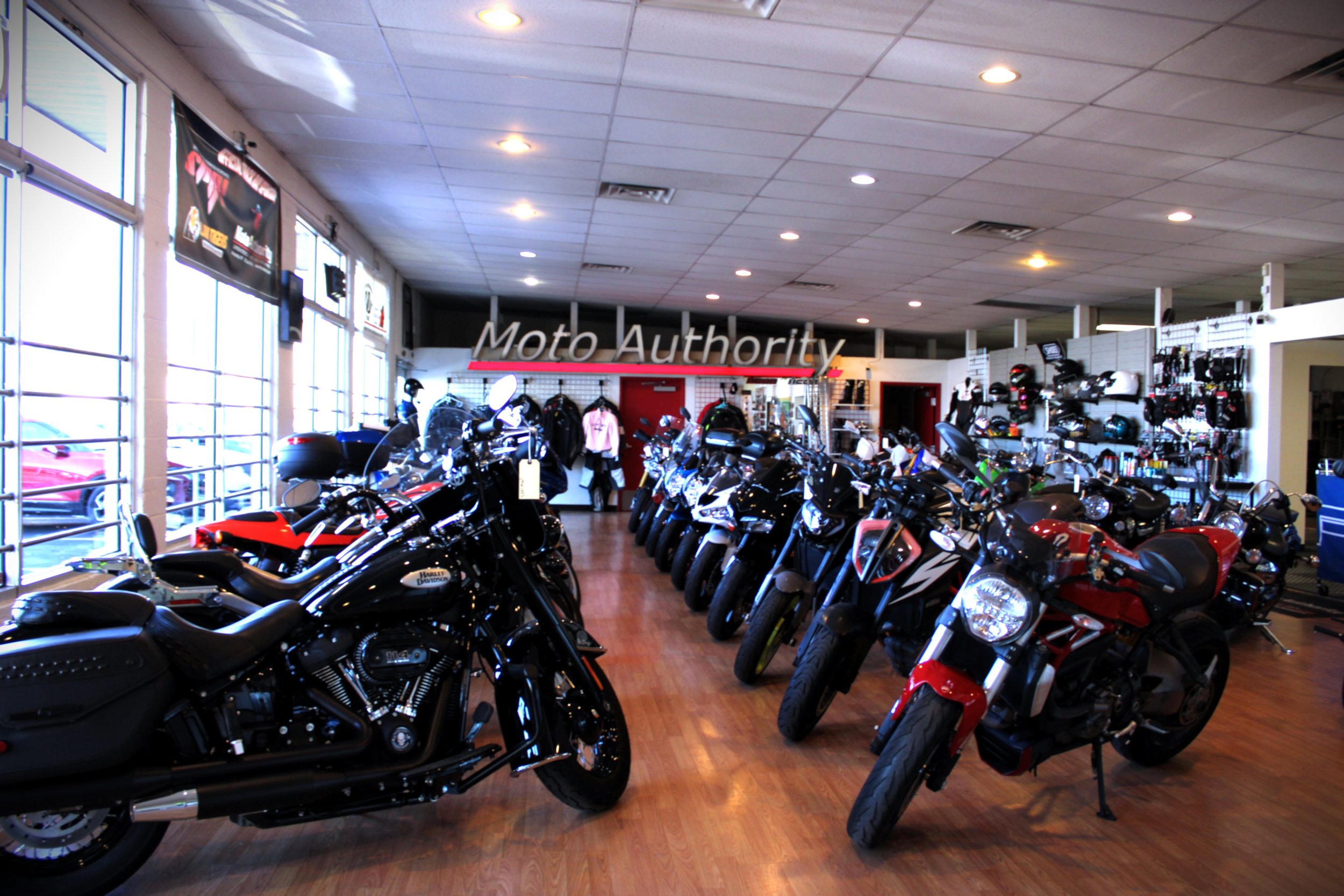 Rider browsing bikes at a dealership, supporting the buying process section