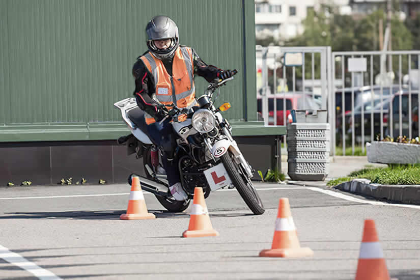 A rider test riding a motorcycle
