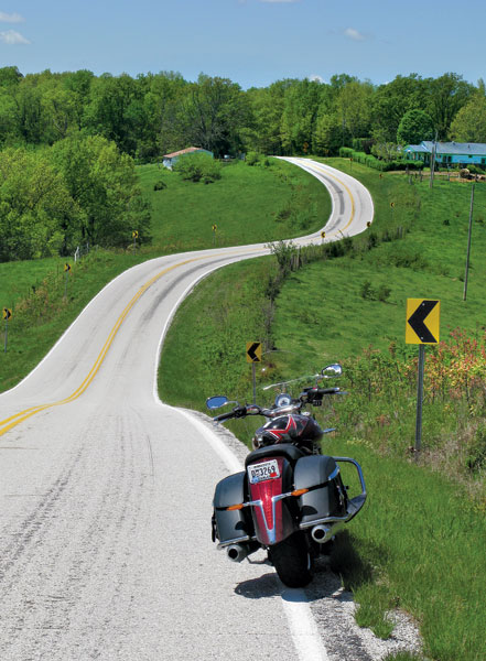 Winding tree-lined road in the Missouri Ozarks, ideal for sport or adventure bike imagery