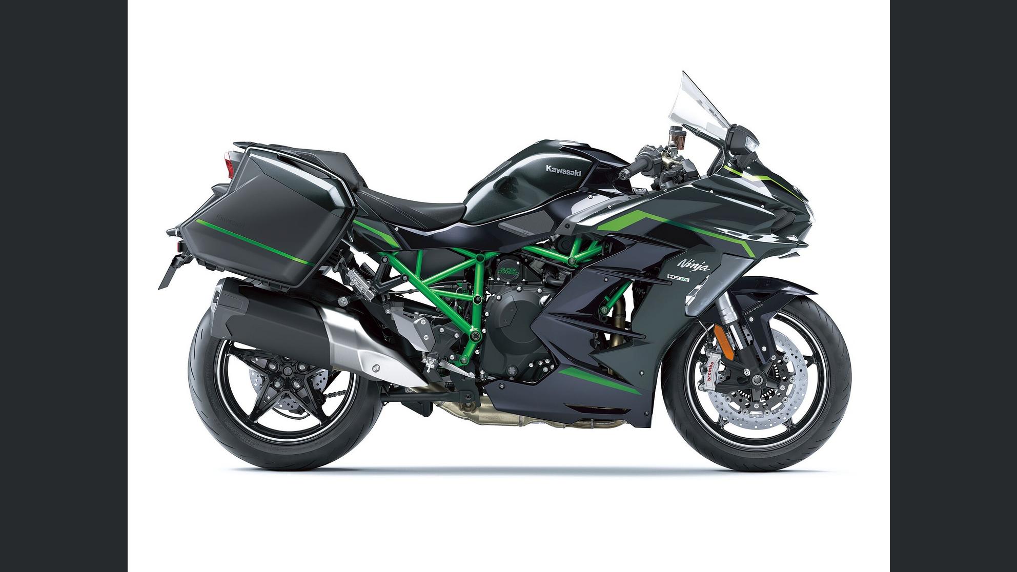 Action shot of rider on H2 SX SE on open highway or mountain road