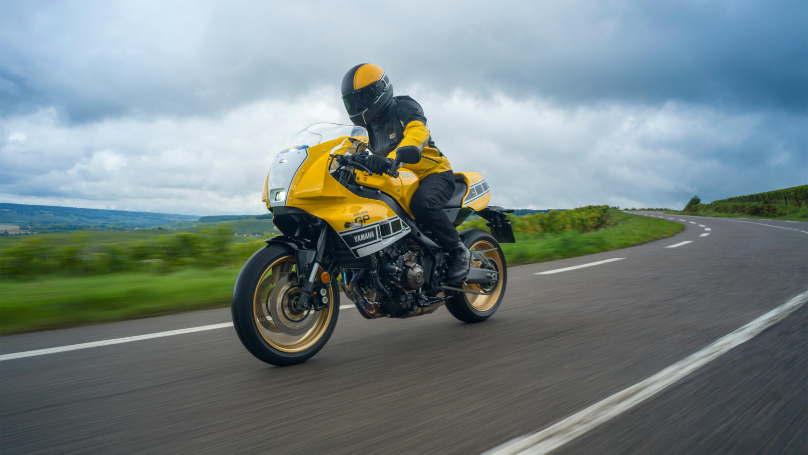 Dynamic riding shot of the XSR900 on a twisty road